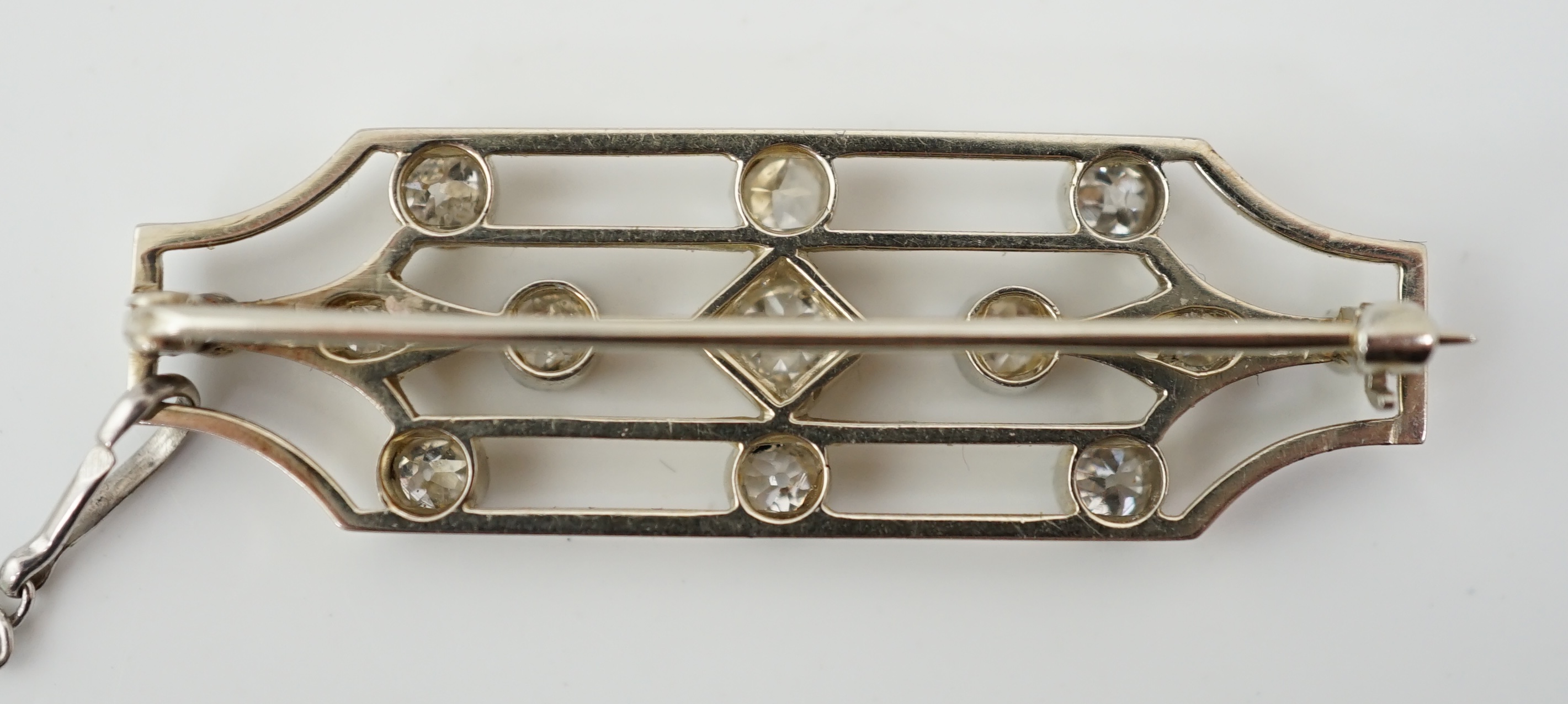 An early 20th century 18ct white gold, platinum and millegrain set diamond cluster openwork brooch
